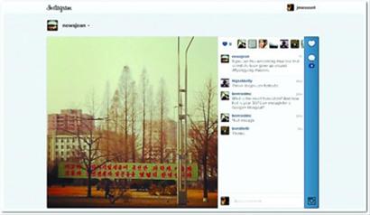 外國(guó)記者吉恩在朝鮮用手機(jī)發(fā)布的第一張Instagram照片平壤街頭的橫幅標(biāo)語(yǔ)。